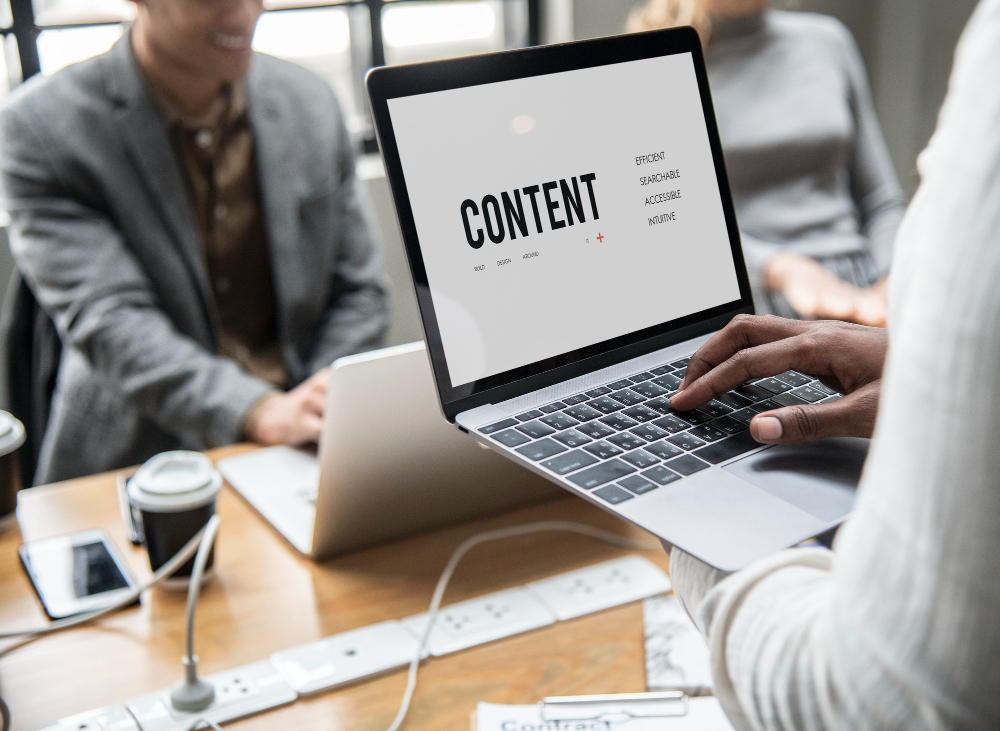 You can see a man trying to align his content according to how the customer wants it in a meeting