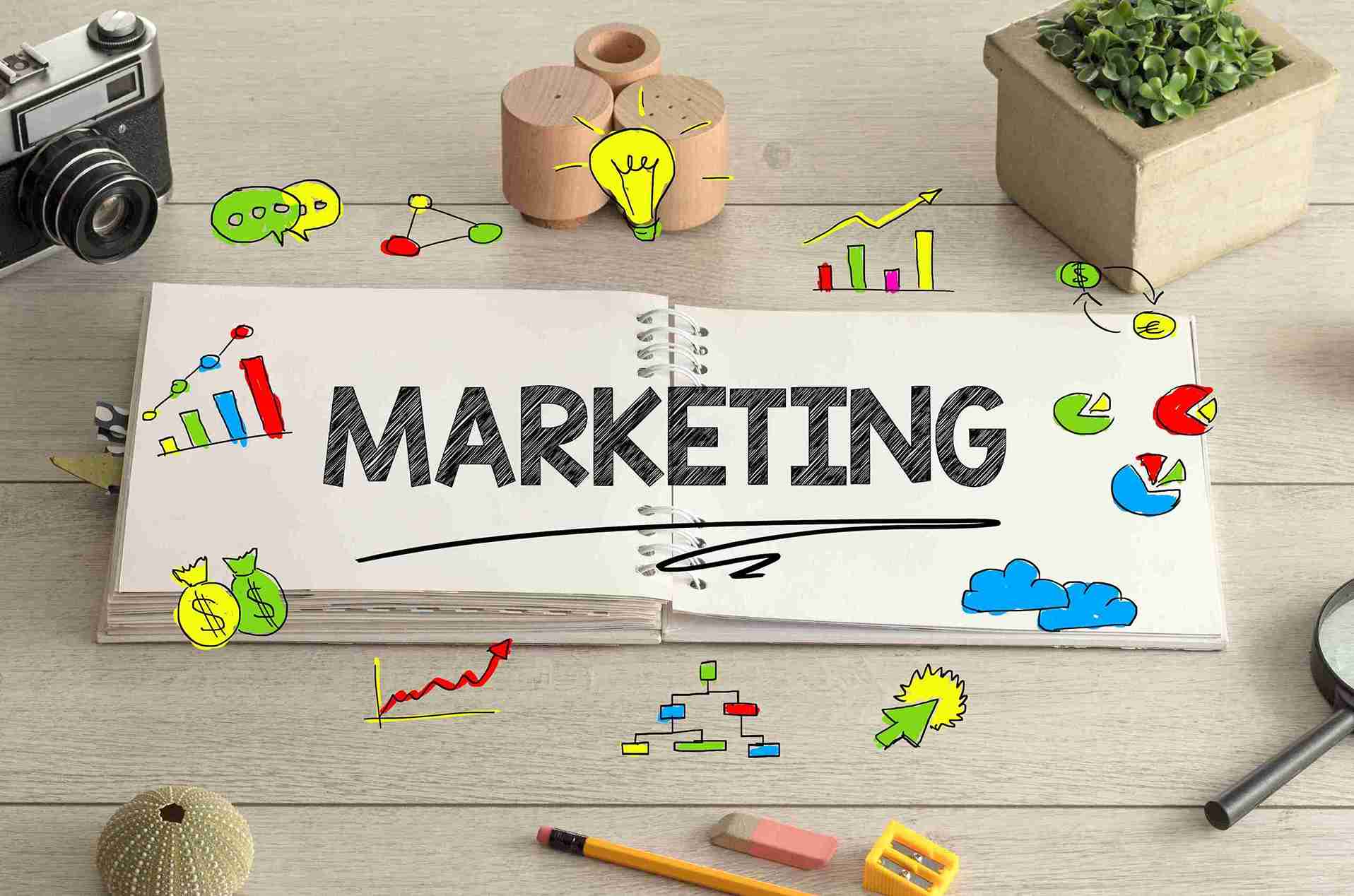 marketing-sketchbook-with-camera-and-office