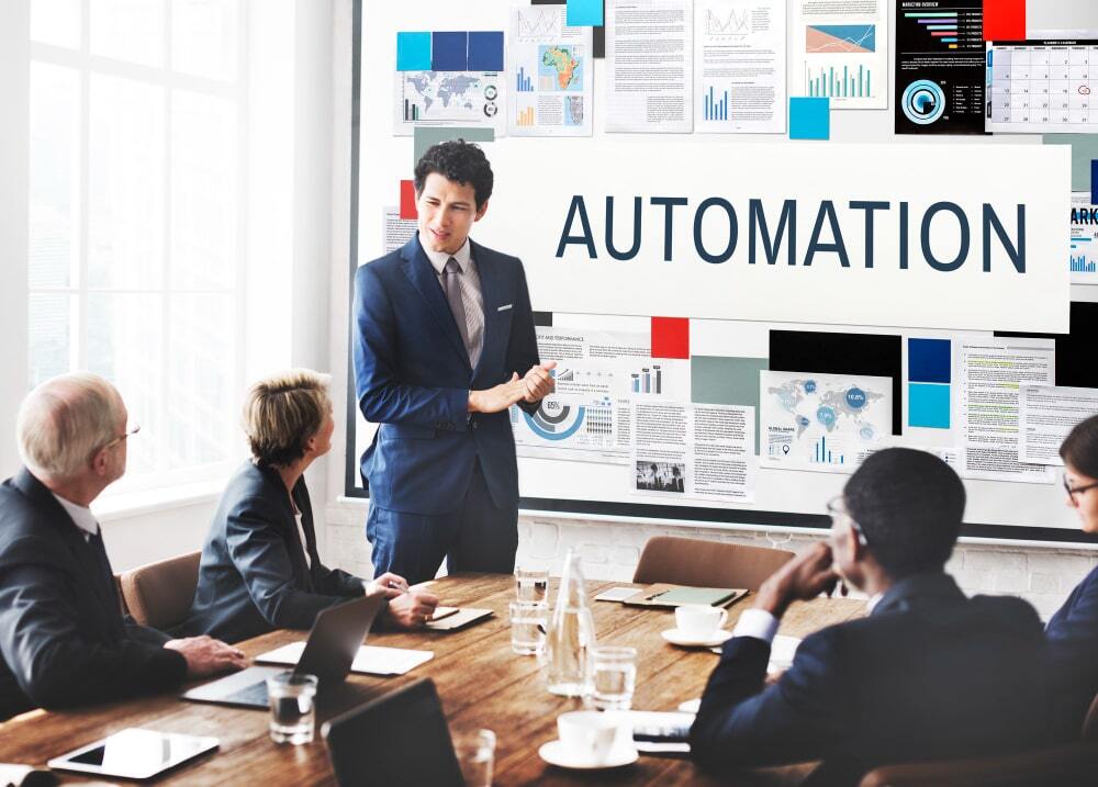 (In the image a person can be seen emphasizing on how beneficial marketing automation will be)