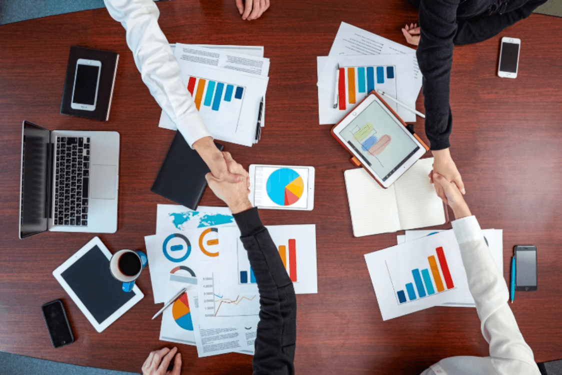 partner handshaking before leaving after completing their marketing management meeting