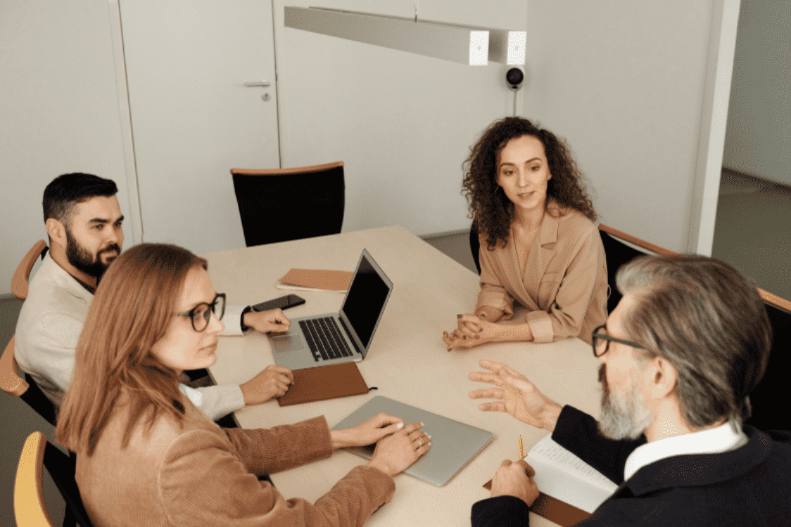 Marketing team discussing cross-channel analytics and attribution models in marketing.