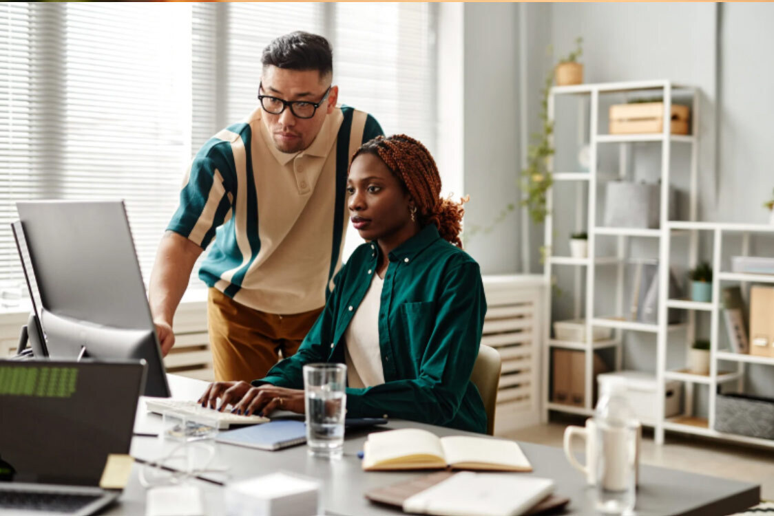 (Developer reviewing web performance optimization results with a colleague.)